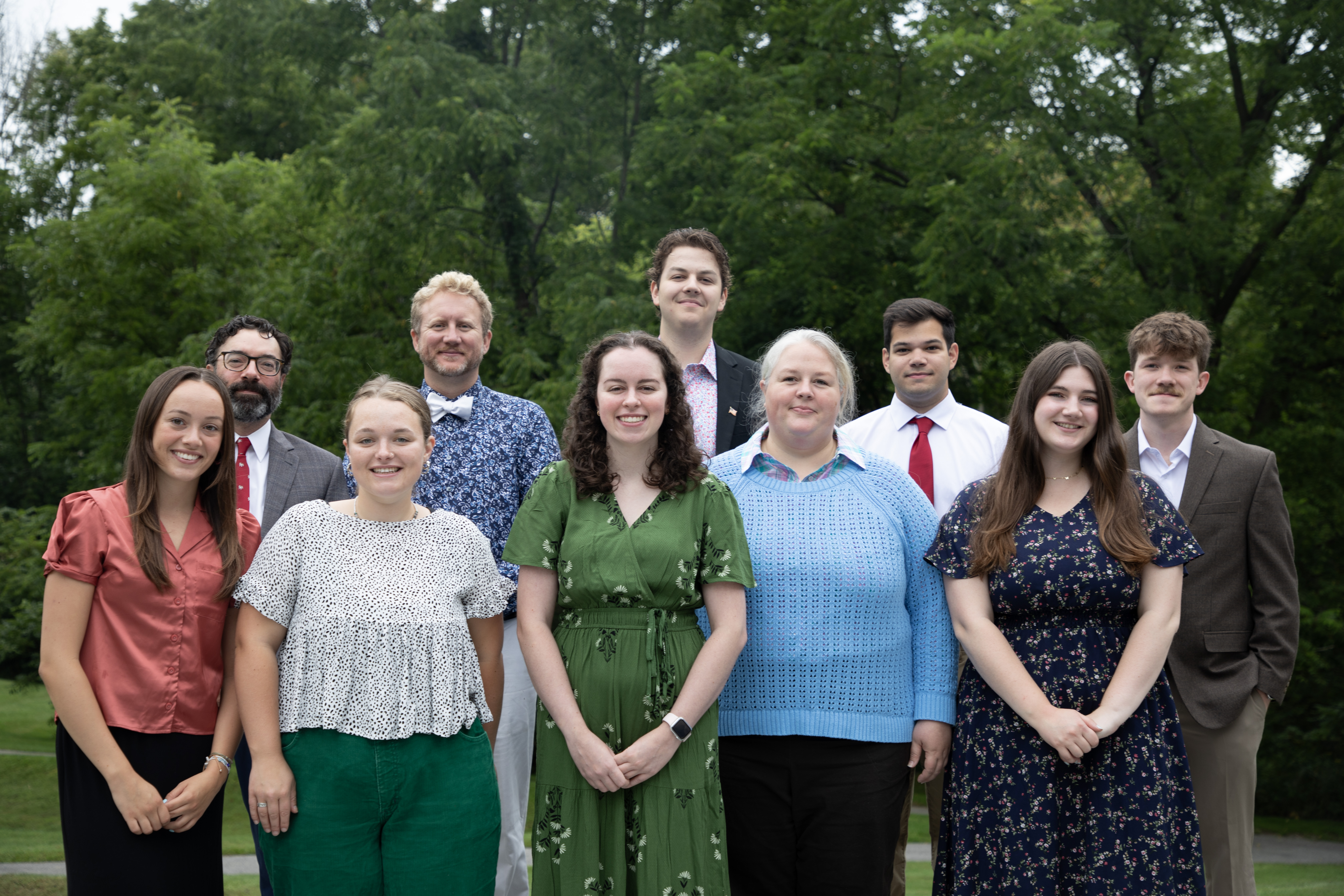 Faculty members standing outside