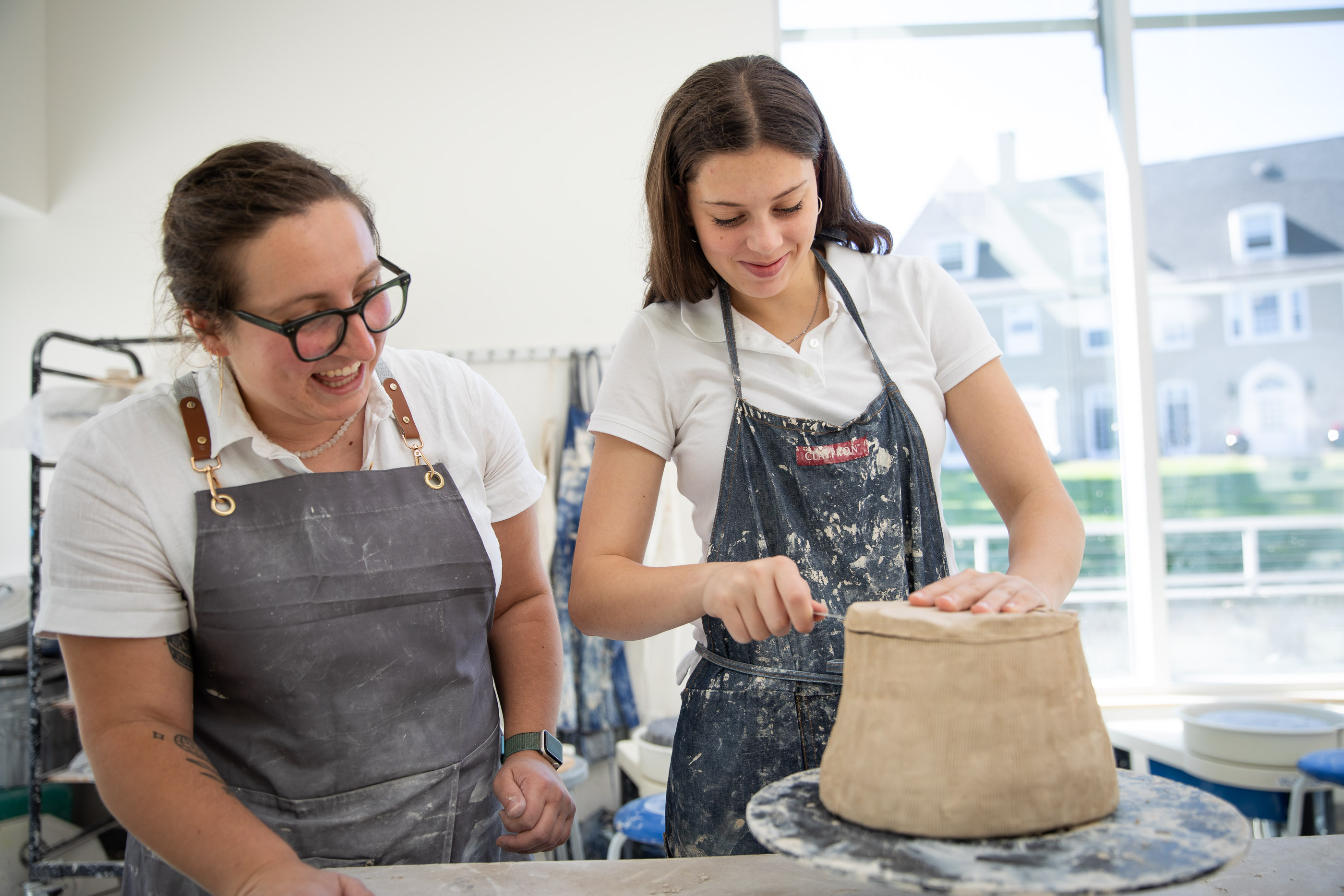 Two people in ceramics studio